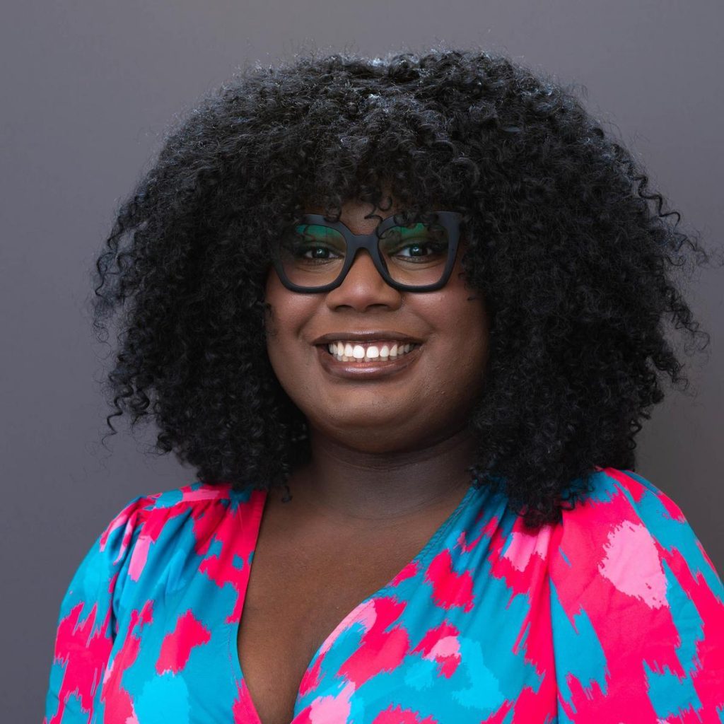 Image of Erin Green in a print dress